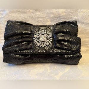 IMAN black evening clutch with rhinestone detail and detachable strap